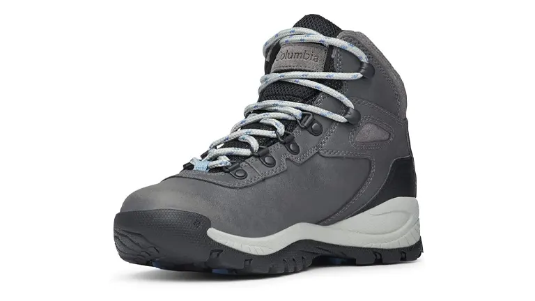 A single gray Columbia brand hiking boot with light blue laces and a contrasting white midsole, designed for outdoor activities, displayed against a white background.


