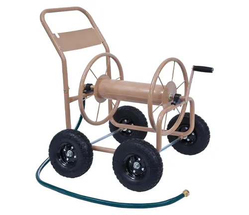Four-wheeled garden hose reel cart with tan frame and black tires, connected to a green hose.