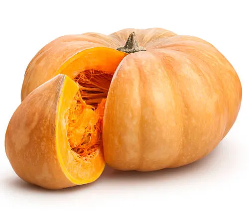 A whole pumpkin with a section cut out, revealing its bright orange interior and seeds, set against a white background.
