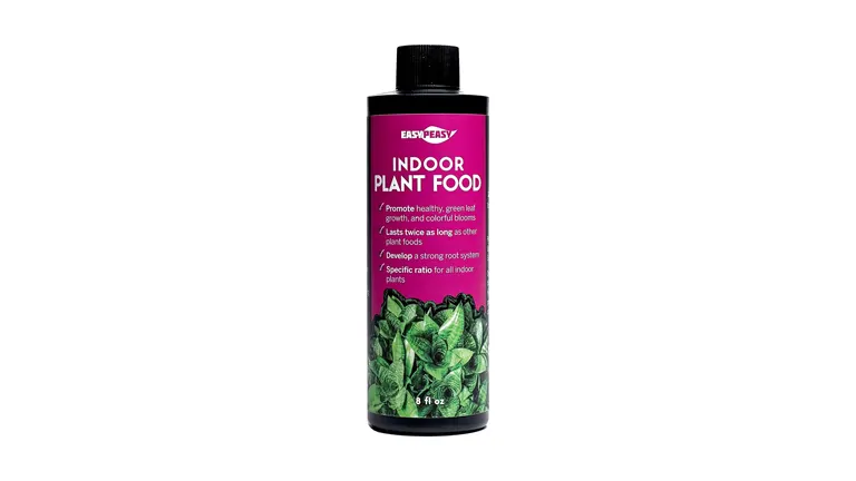 A bottle of Easy Peasy Indoor Plant Food, an 8 fl oz liquid fertilizer with a purple label featuring images of green leaves, promoting healthy growth and strong roots for indoor plants.
