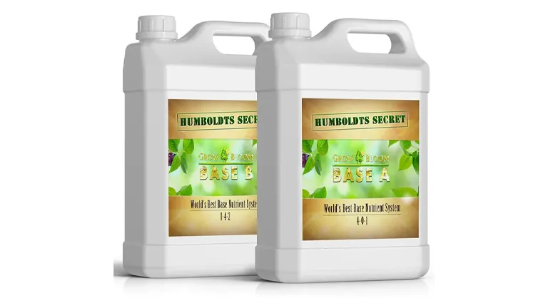 Two white jugs of Humboldts Secret Base A & B, part of a liquid hydroponic fertilizer system, labeled for vegetative and flowering stages of plant growth.

