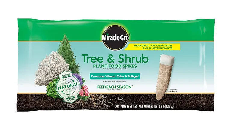 Bag of Miracle-Gro Tree & Shrub Plant Food Spikes, advertised to promote vibrant color and foliage, suitable for evergreens and acid-loving plants, containing 12 spikes.