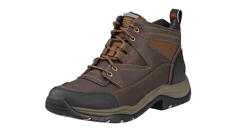 A brown hiking boot featuring robust lacing, a reinforced toe cap, and breathable side panels, set on a sturdy sole with a light tan midsole, against a white background.
