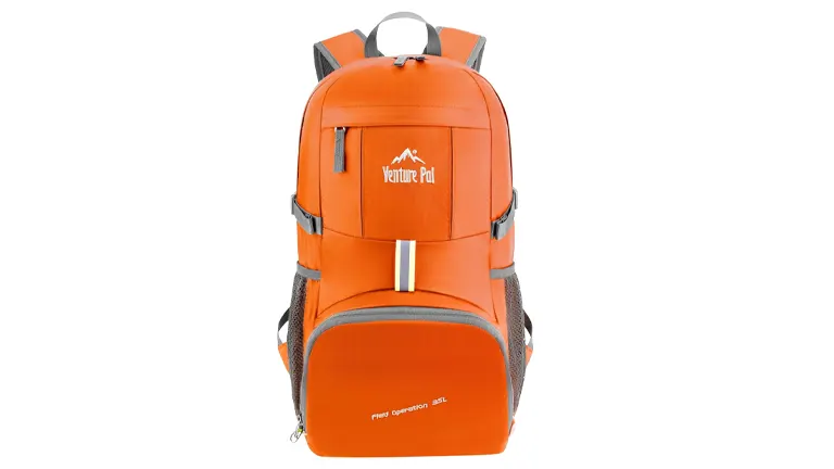 An orange Venture Pal hiking backpack with grey trim, featuring a main compartment, a front zippered pocket with a reflective strip, side mesh pockets, and adjustable padded shoulder straps. The backpack is designed with functionality and visibility in mind for outdoor activities.
