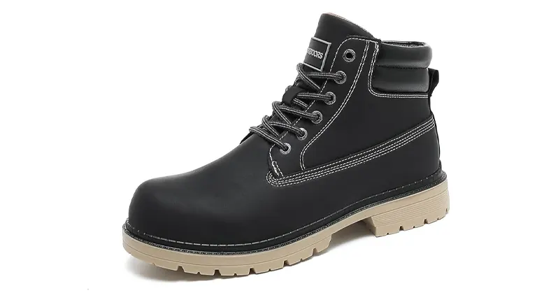 A single black ankle boot with a chunky tan sole and classic lace-up front, featuring white stitching details and a logo on the side, presented on a white background.
