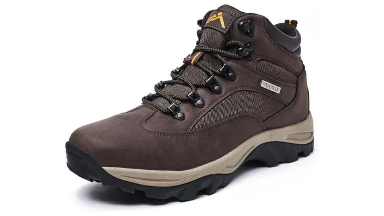 A single brown hiking boot with black and tan accents, featuring a mesh upper for breathability, reinforced eyelets for laces, and a rugged outsole for grip, set against a white background.

