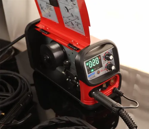 Open Ironton FC140 Flux-Cored Welder with digital display and welding torch.