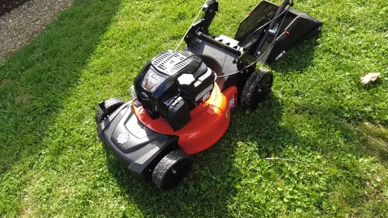 Ariens Razor 21 Mower sitting on the grass with bagging system on the back