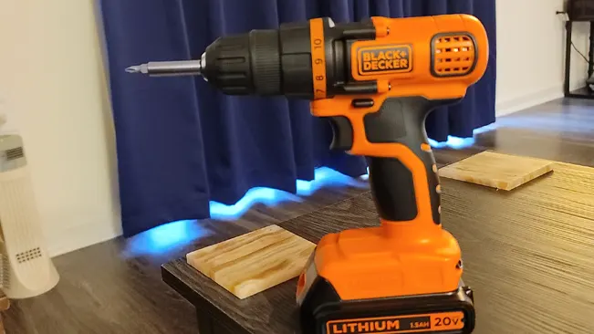 BLACK+DECKER 20V MAX cordless drill/driver in orange and black on a table