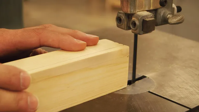 Person using Bandsaw Blade