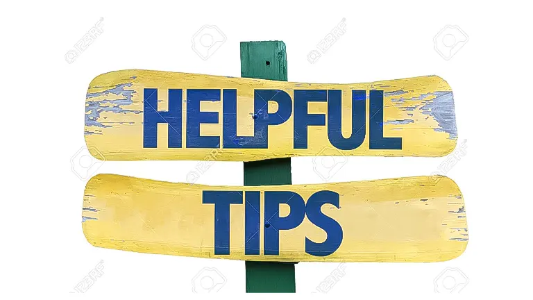Two yellow, weathered wooden signs crossed over each other with the words "HELPFUL TIPS" in blue paint