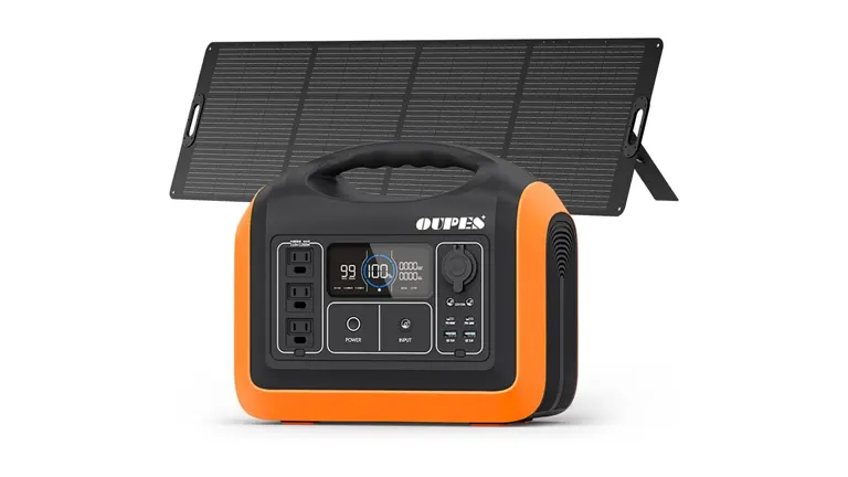 A portable OUPES solar generator in black and orange with a digital display, in front of an unfolded solar panel
