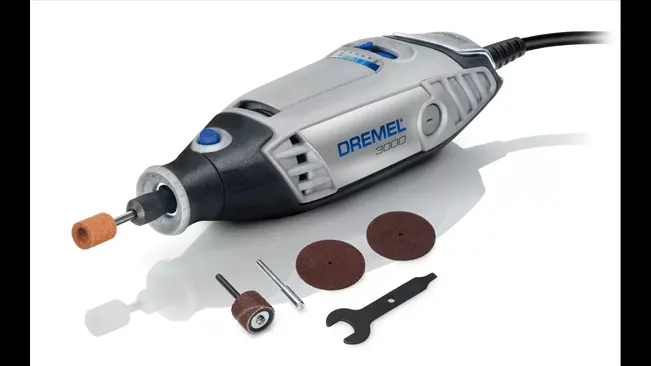 Dremel 3000 rotary tool with attachments and wrench.