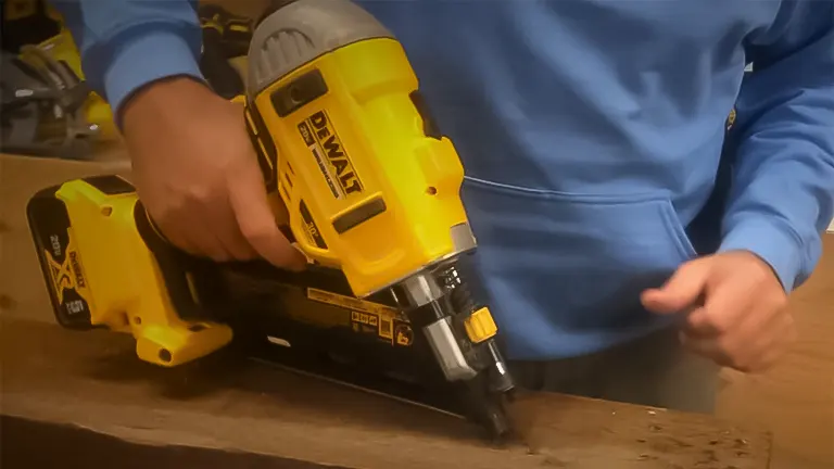 Close-up of a DEWALT DCN692B 20V MAX XR Framing Nailer being used on wood