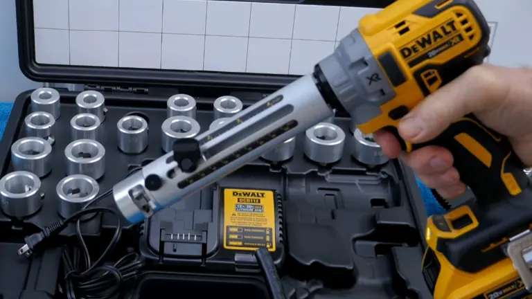 Person holding DeWalt 20V Cable Stripper infront of the tool kit
