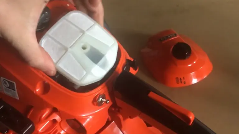 Person holding the Echo CS 490 Chainsaw Air Filter