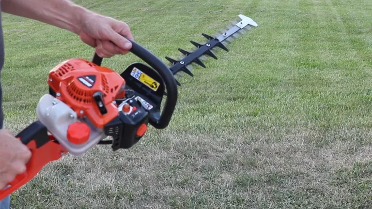 Person holding Echo HC-2020 Gas Powered Hedge Trimmer in a wide area