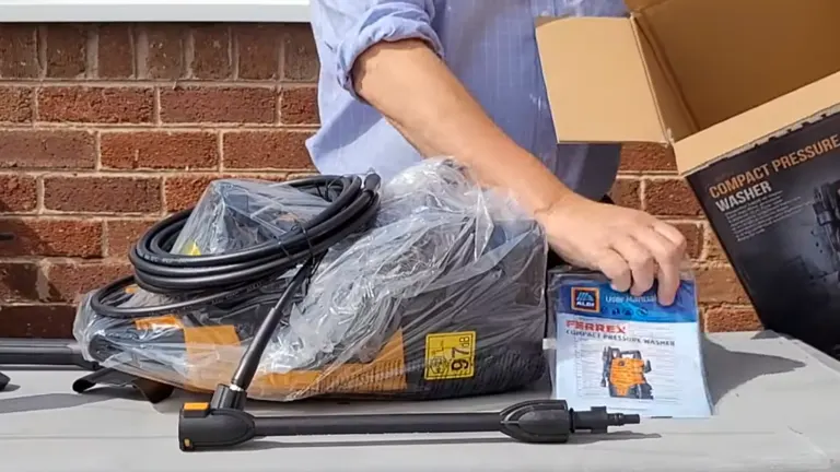 Person unboxing the Ferrex Electric Pressure Washer
