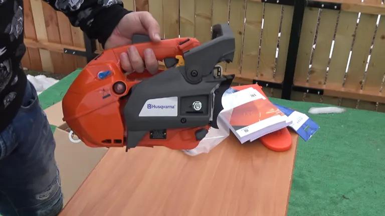 Person done unboxing and holding the Husqvarna T435