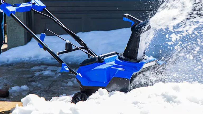 Person shoving the snow using Kobalt 40V Snow Blower