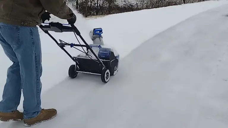 Person pushing the Kobalt 40V Snow Blower in the thick snow