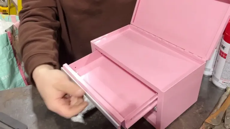Person opening drawer of the Kobalt Mini Pink Drawer Steel Tool Box