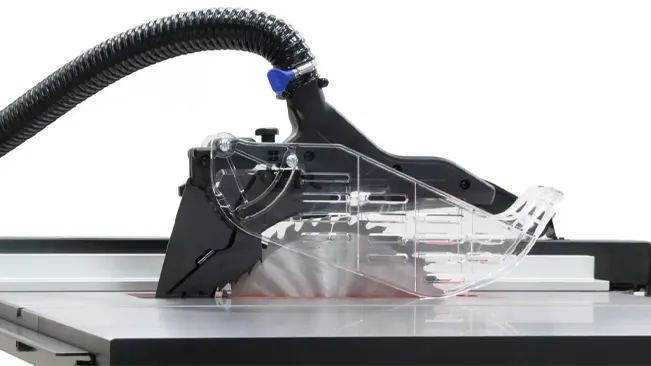 Table saw with transparent blade guard and dust collection hose