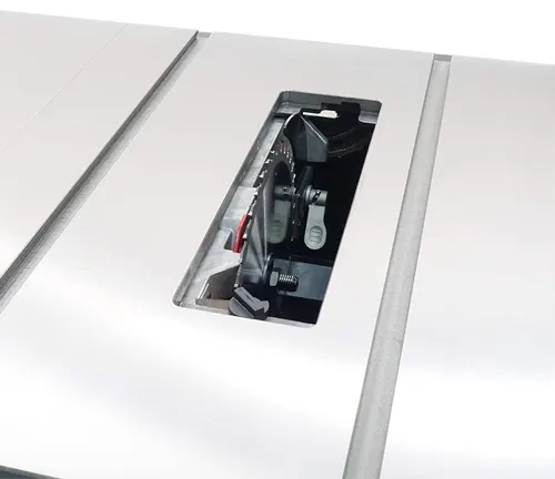 Table saw with built-in storage compartment holding accessories.