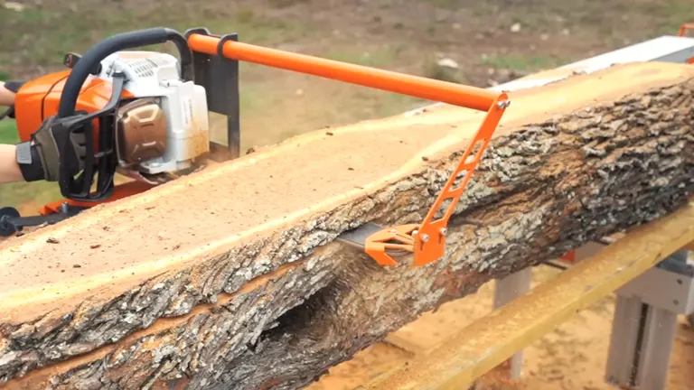 Logosol F2 Chainsaw Mill in action, cutting through a large log outdoors.