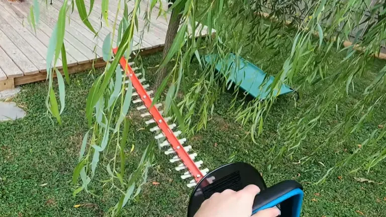 Person cutting the vines using the Makita 18V LXT Cordless Hedge Trimmer