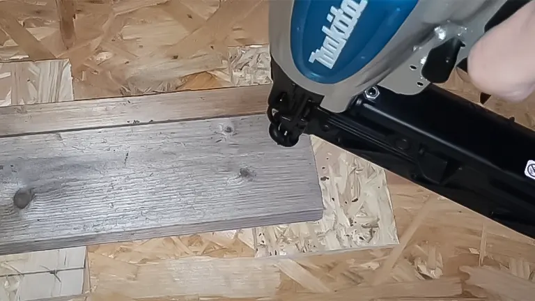 Makita AF601 Finish Nailer in action on a wooden plank
