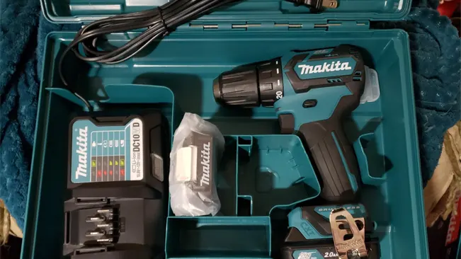 Makita FD07R1 cordless driver-drill kit laid out in its case with charger, battery, and accessory bag