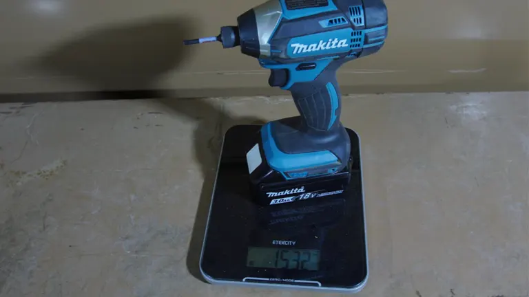 Makita XDT11Z 18V Impact Driver standing on the weighing scale 