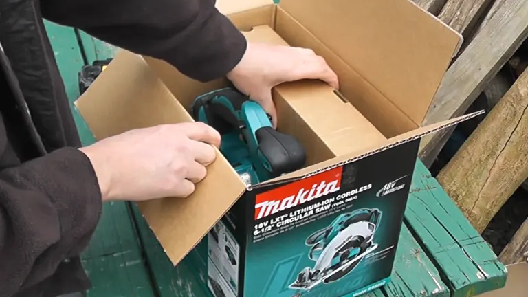 Person unboxing the Makita XSS02Z 18V Circular Saw
