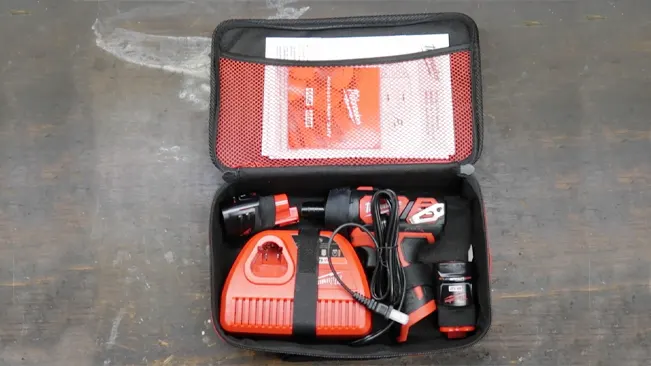 Open case of Milwaukee 2401-22 M12 Cordless Screwdriver kit with tools and manual