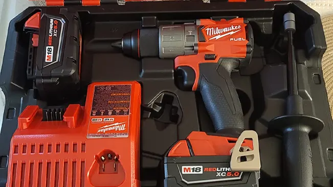 Milwaukee M18 FUEL hammer drill kit with drill, battery, and charger in a case