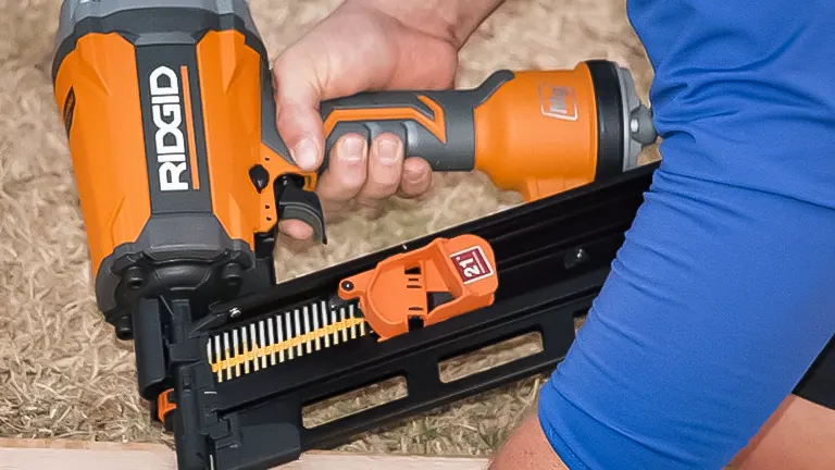 Close-up of a person using the Ridgid R350CHD framing nailer on wood
