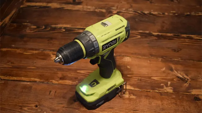 Ryobi P252 drill/driver with battery on a polished wooden floor.