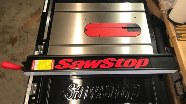 Top view of a SawStop table saw with logo and retracted blade insert plate.