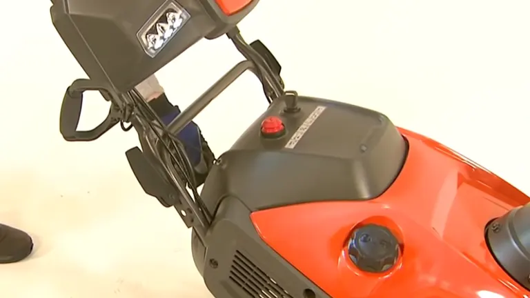 Person adjusting the choke to off position of the Husqvarna Snow Blower