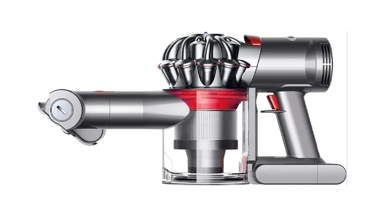 Profile view of a Dyson V7 Trigger handheld vacuum, showcasing its cyclone technology and clear dustbin