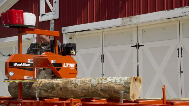Person using Wood-Mizer LT15 with big log on it 