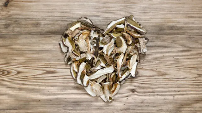 A sliced mushrooms in a heart shaped.