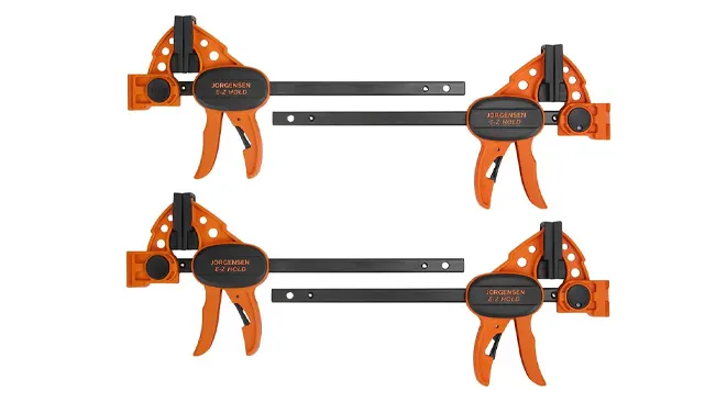 A set of four orange Jorgensen 6" Spreader/Bar Clamps.