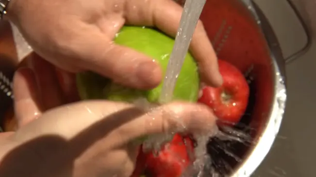 Washing a green apple