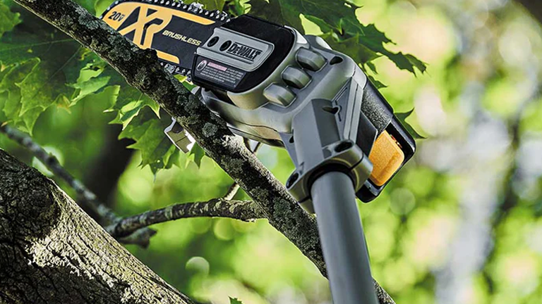 DeWalt DCPS620M1 brushless pole saw in use, cutting a branch in a tree. The saw, with a yellow and black color scheme, is visible on a thick branch, highlighting its extended pole and utility.