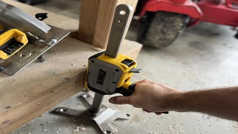 DeWalt ToughSeries Construction Jack in use, lifting a wooden bench leg, demonstrating its practical application in a workshop setting.