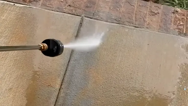 Person trying the Husqvarna 3200 PSI Gas Pressure Washer in the cement