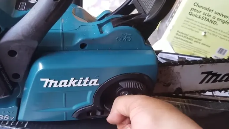 Person using the tool less chain adjust of Makita XCU03PT Chainsaw
