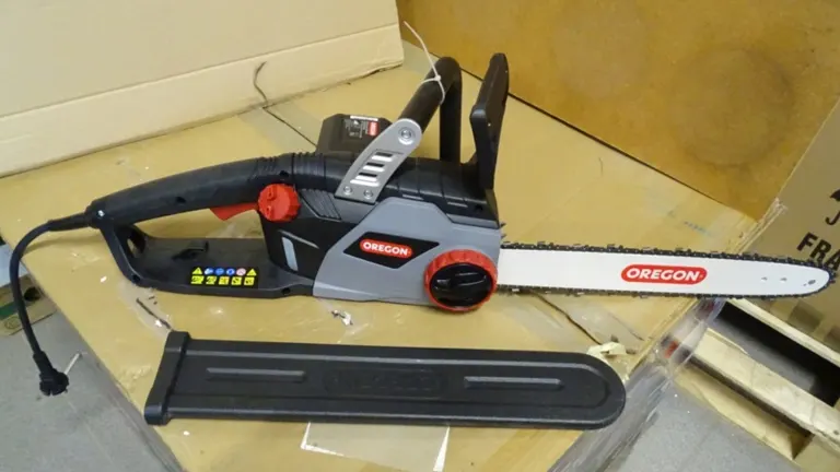 New Oregon electric chainsaw displayed with its box and accessories on a table.
